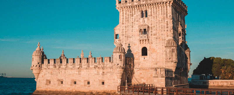 Belém Tower, a historic landmark of Lisbon and UNESCO World Heritage Site, with the Tejo River in the background.