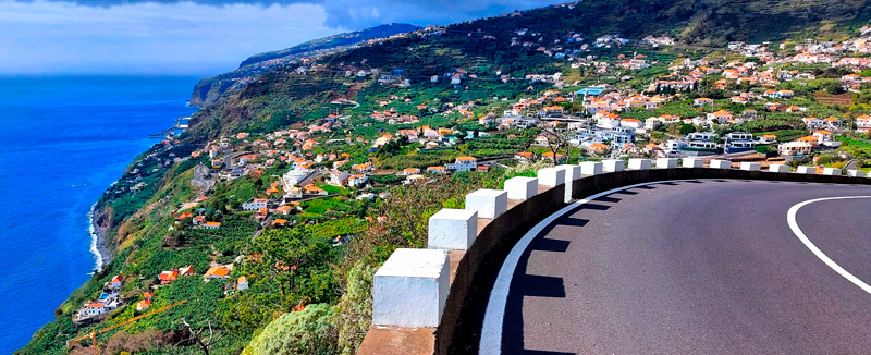 Winding road with views of the ocean and the landscape of Madeira Island