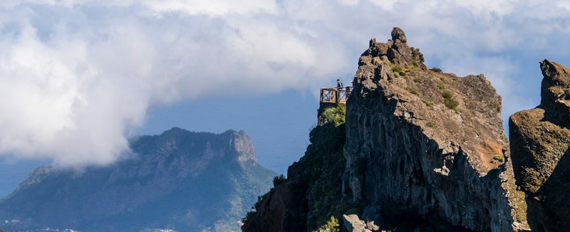 View from Pico do Areeiro in Madeira during the day with clouds drifting through the mountains
